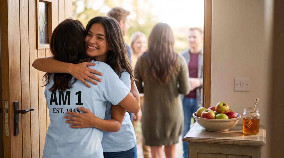 Woman in a Jewish holiday t-shirt greeting guests for Rosh Hashanah