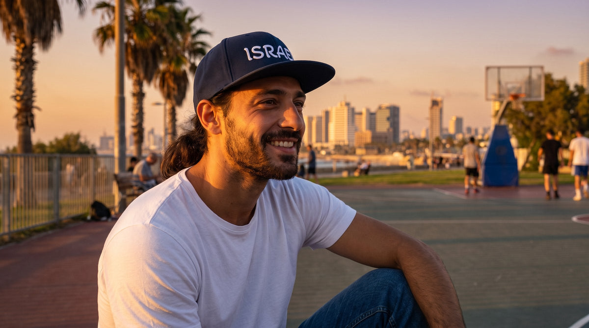 Man wearing the Israel snapback cap at a Tel Aviv park - emohtee caps