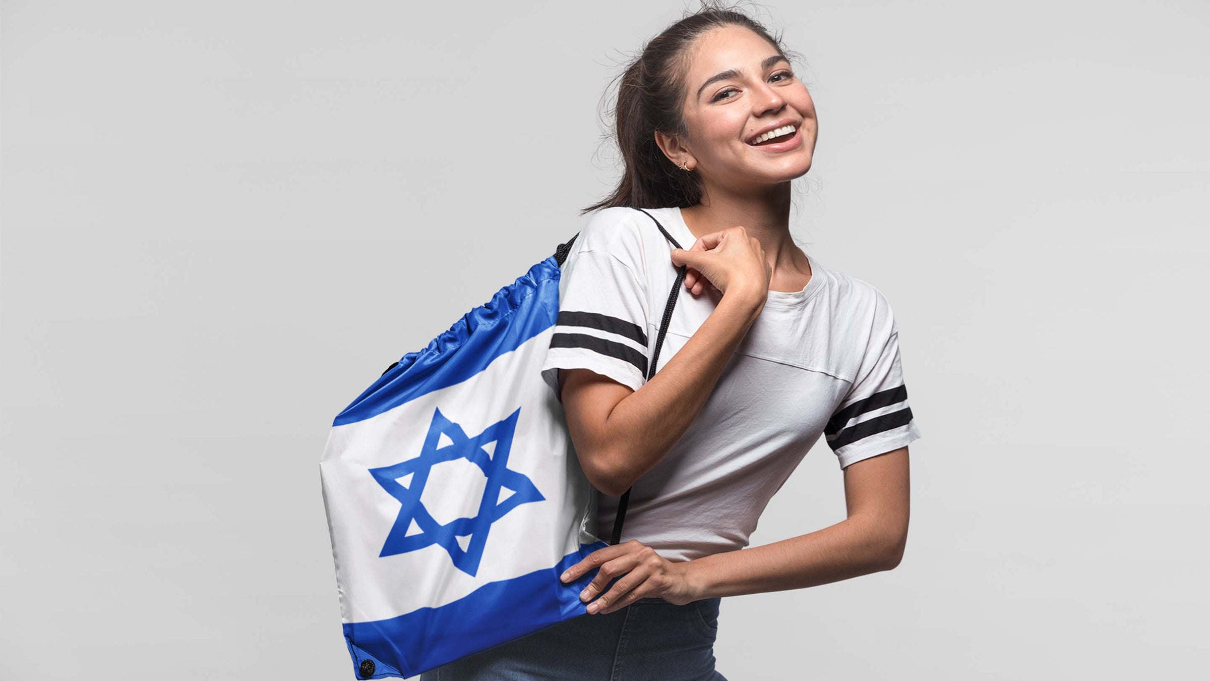 women with drawstring bag, Israel flag