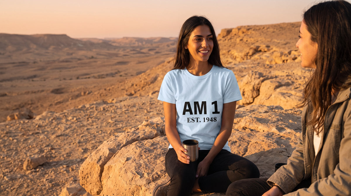 AM 1 T-shirt worn by a woman in the Negev desert at sunrise – MoT Member of the Tribe