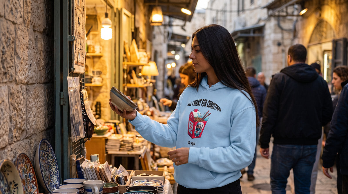 Christmas hoodie worn by a woman in the stone alleys of the Jerusalem Old City – MoT Member of the Tribe