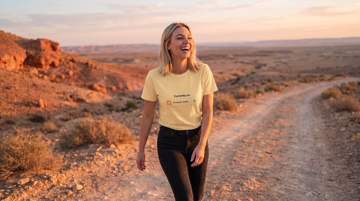 Chutzpah Mode T-shirt worn by a woman in the Negev desert at sunrise – MoT Member of the Tribe