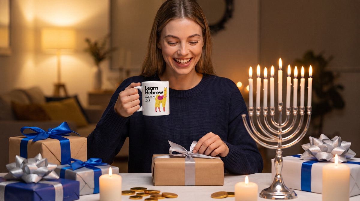Woman unwrapping the Learn Hebrew Llama Lo mug beside a lit hanukkiah - emohtee Hanukkah gifts