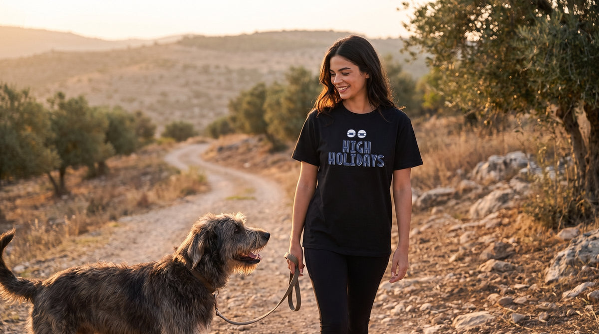 High Holidays T-shirt worn by a woman in the Galilee hills at sunset – MoT Member of the Tribe