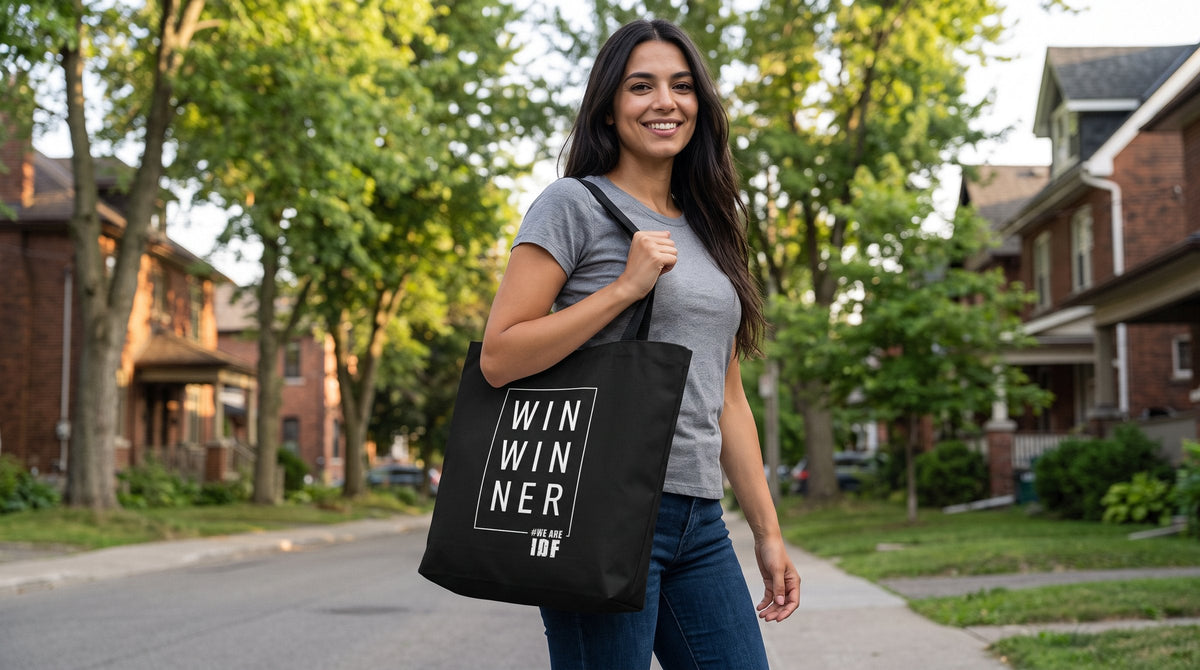 Woman carrying the War Winner tote bag - emohtee IDF collection