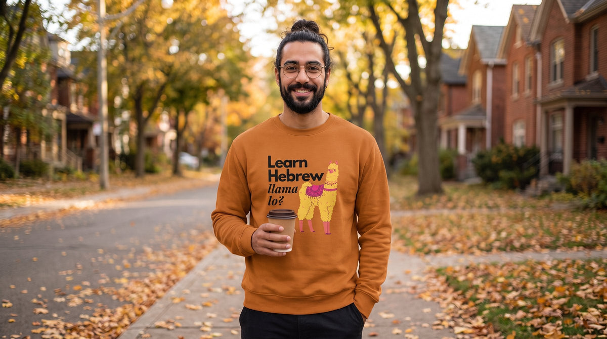 Man wearing the Learn Hebrew Llama Lo premium sweatshirt on an autumn street - emohtee men sweatshirts