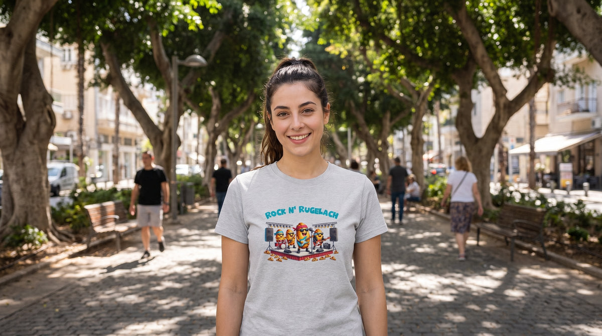 Rock n' Rugelach T-shirt worn by a woman on Rothschild Boulevard in Tel Aviv under the ficus trees – MoT Member of the Tribe