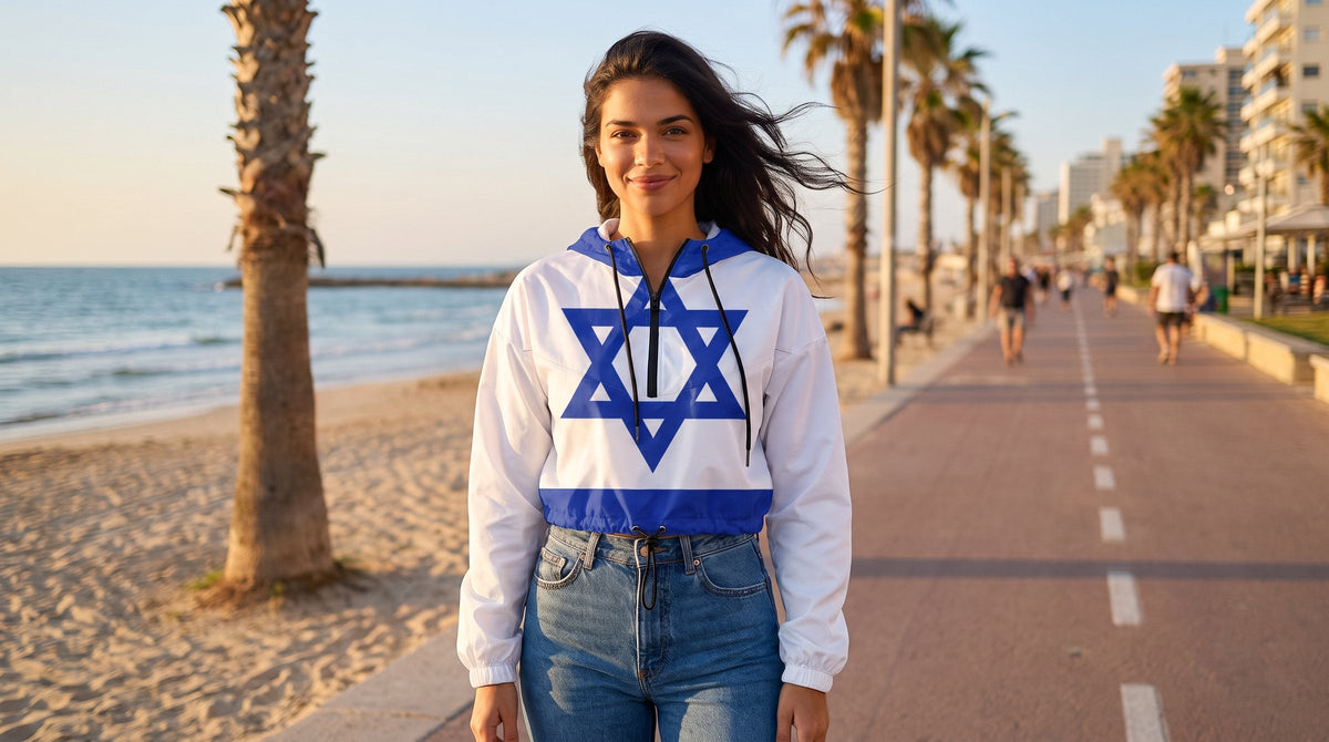 Woman wearing the Israel flag cropped windbreaker on the Tel Aviv promenade - emohtee solidarity with Israel