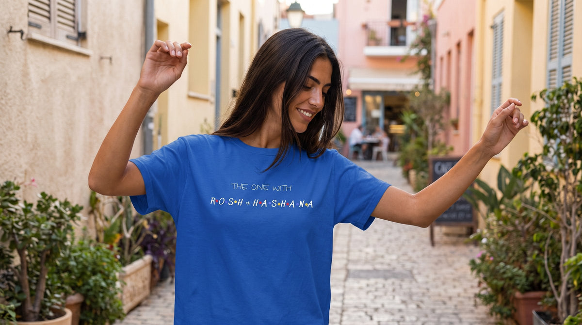 The One with Rosh HaShana T-shirt worn by a woman in the pastel lanes of Neve Tzedek, Tel Aviv – MoT Member of the Tribe