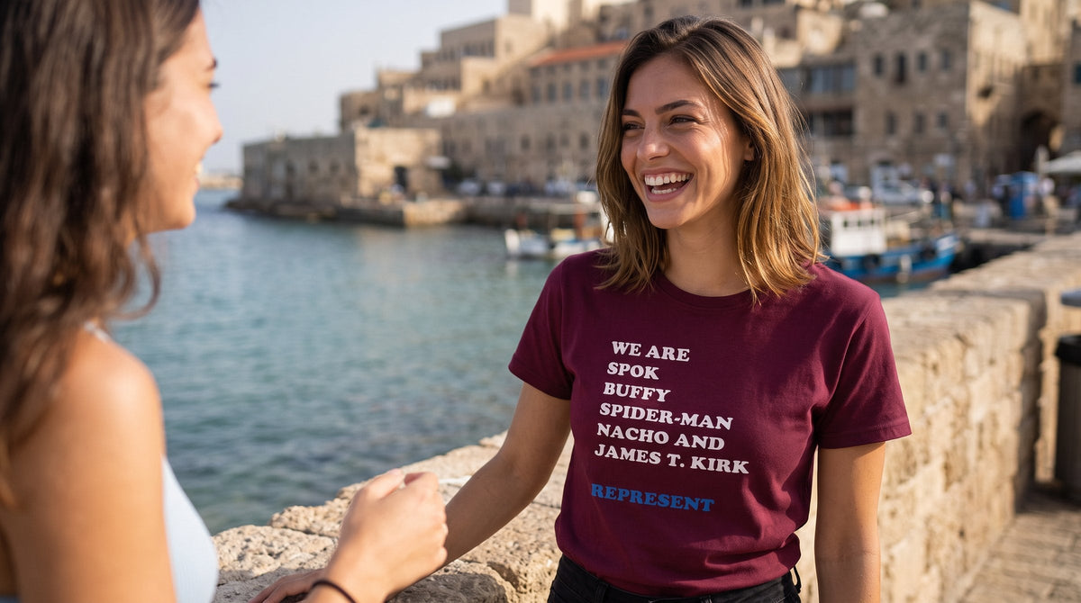 We are Iconic Roles 2 T-shirt worn by a woman at the old port of Jaffa – MoT Member of the Tribe