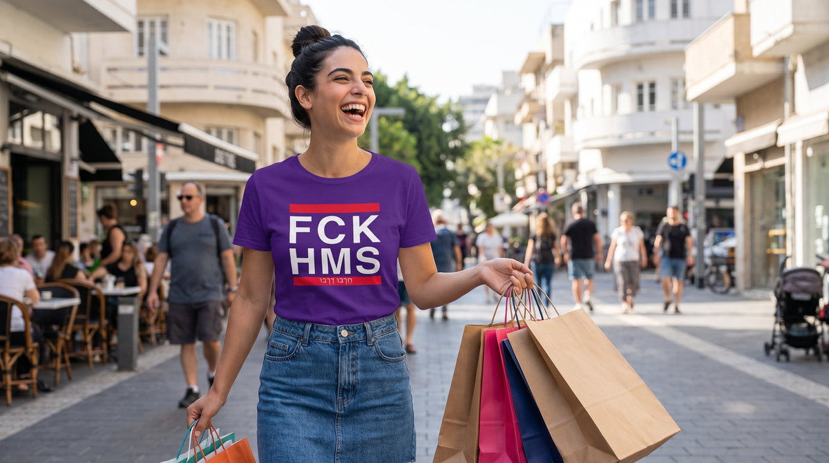 Woman wearing the FCK HMS tee shopping on Dizengoff Street - emohtee women