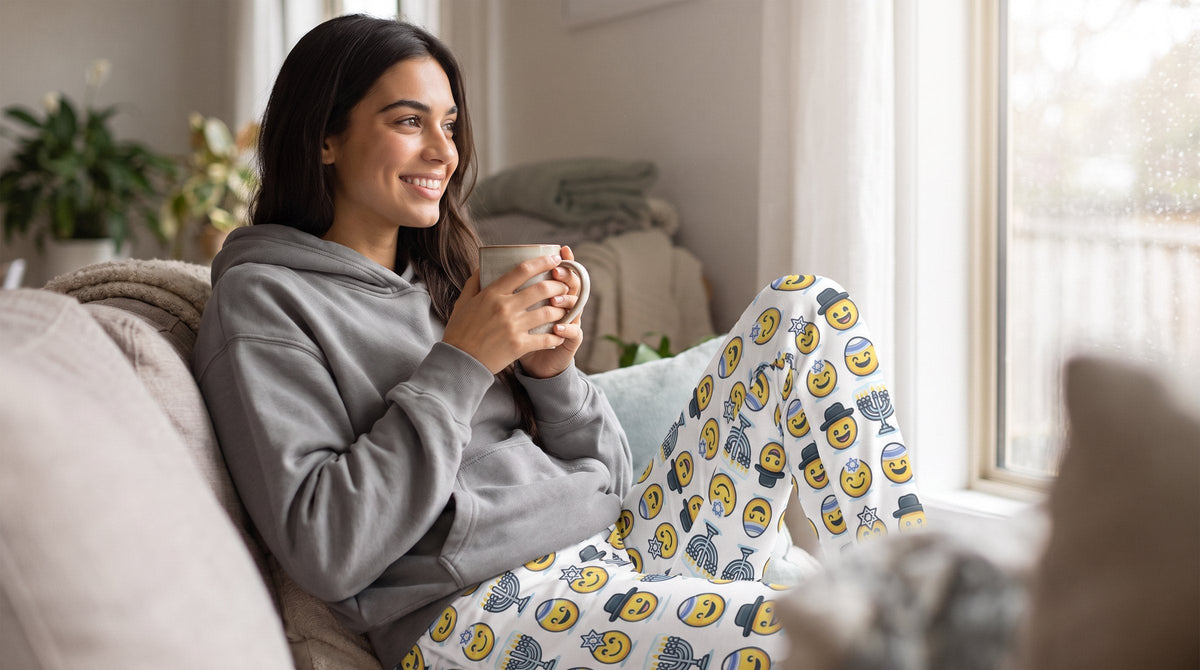 Woman relaxing in Jewish Emoji joggers on a sofa - emohtee women sweatpants and joggers