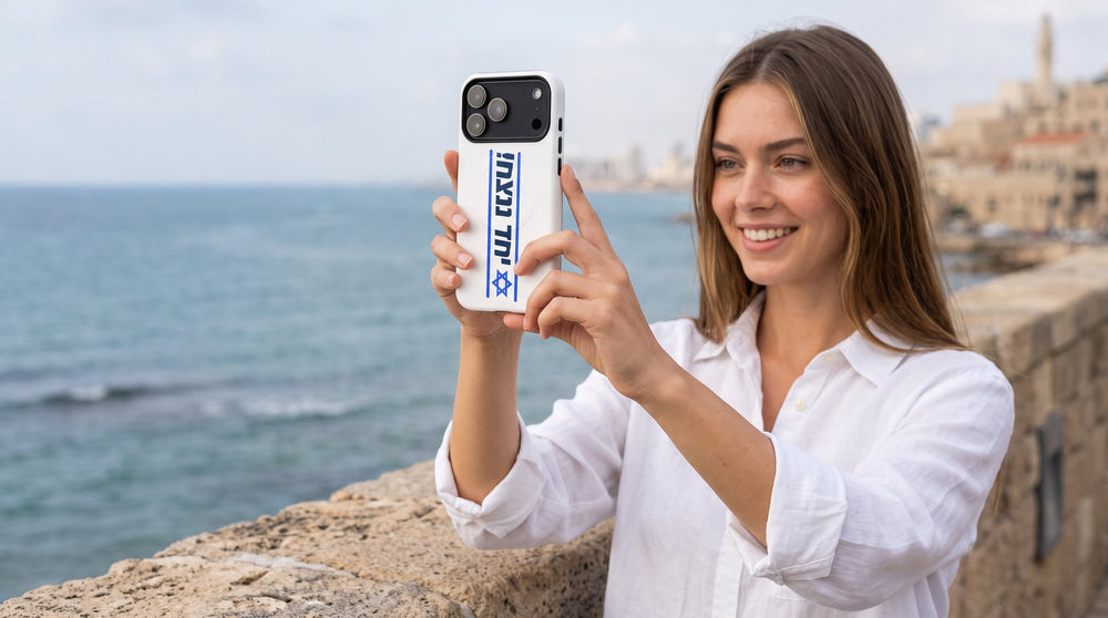 Together we will win MagSafe tough case for iPhone held by a woman at a Jaffa sea lookout – MoT Member of the Tribe