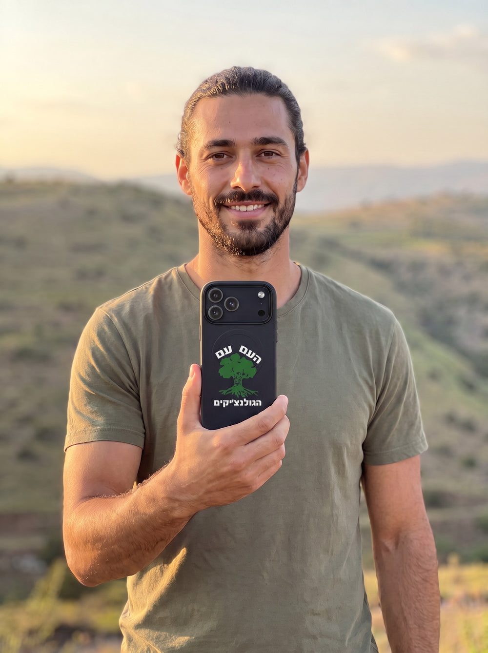 Man on the Golan Heights holding the new iPhone 18 Pro Max in a Golani MagSafe tough case by MoT Member of the Tribe
