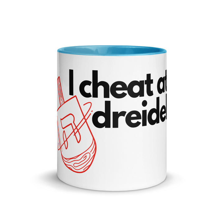 I Cheat At Dreidel Jewish pride mug with color inside - flat lay