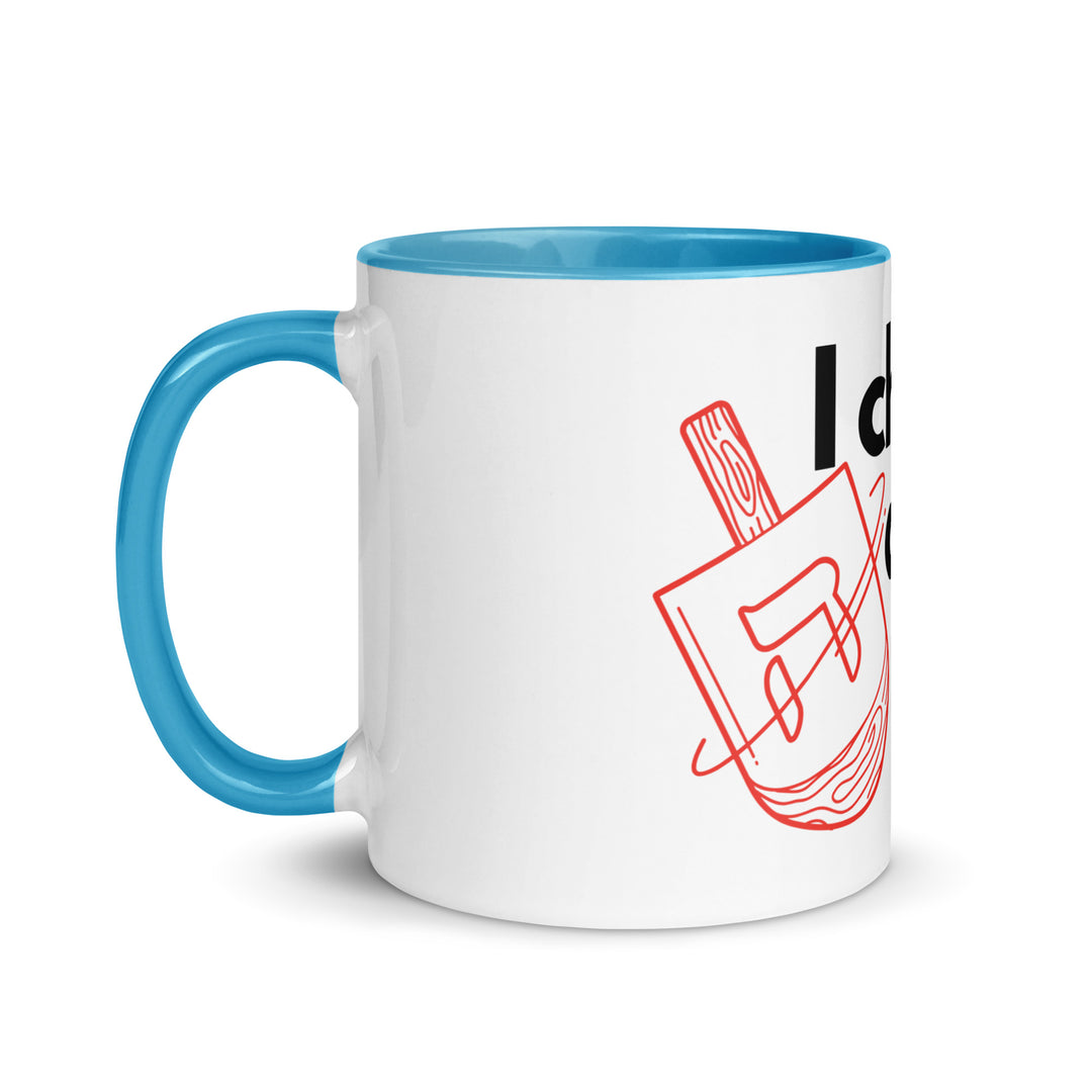 I Cheat At Dreidel Jewish pride mug with color inside - lifestyle shot