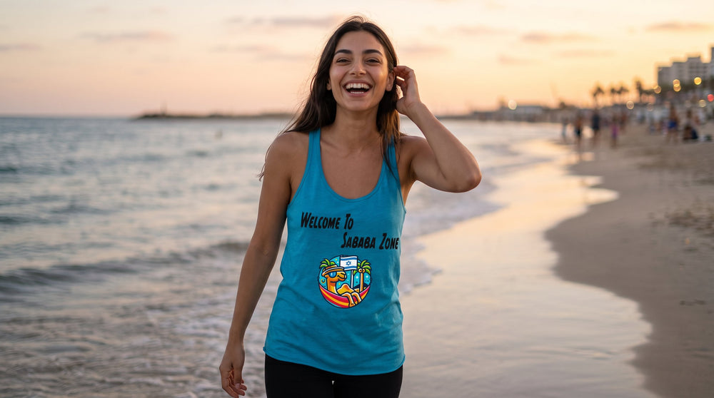 Sababa Zone women's racerback tank worn by a woman on a Tel Aviv beach at sunset – MoT Member of the Tribe